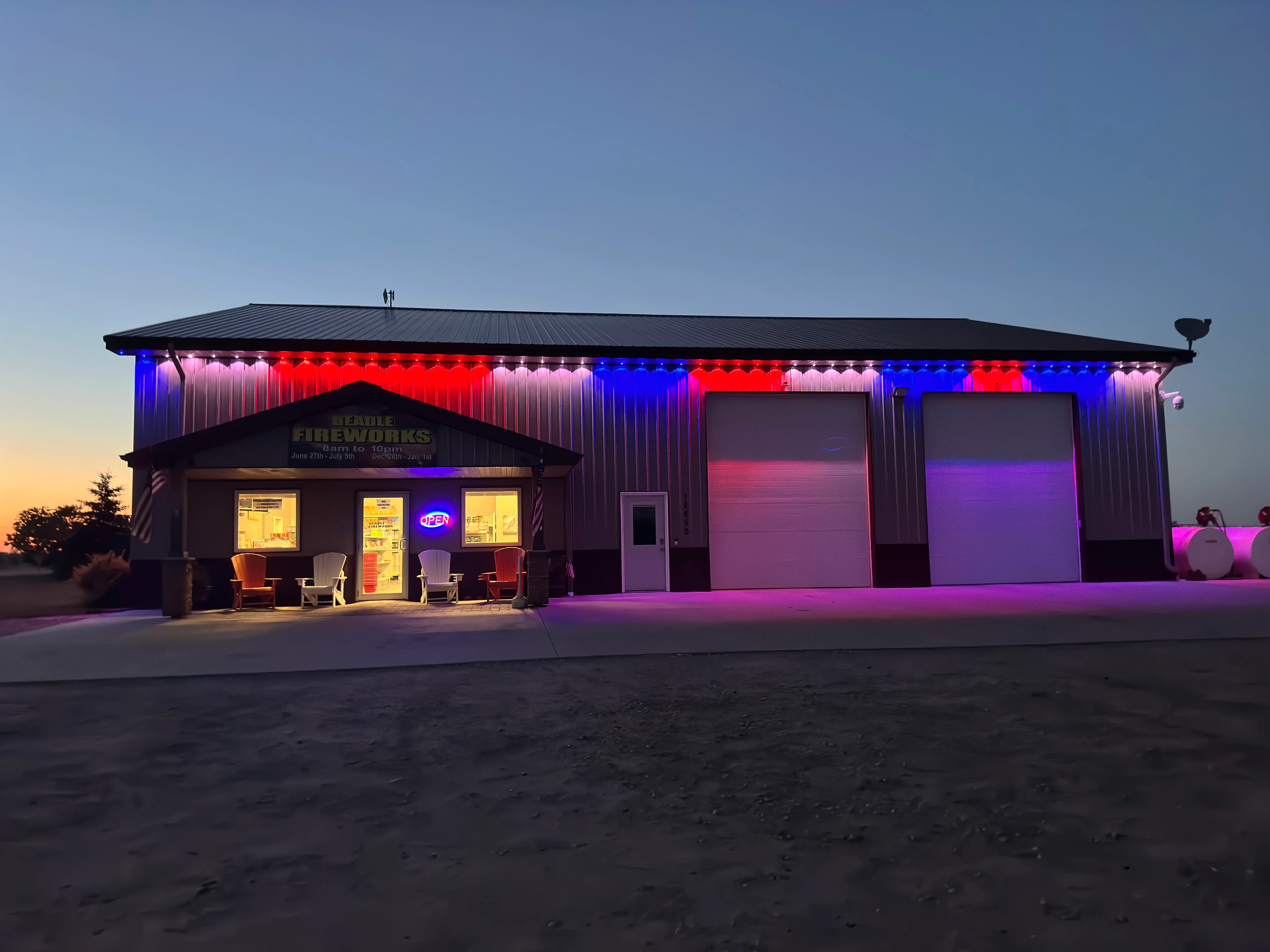 Beadle Fireworks store lit up at dusk